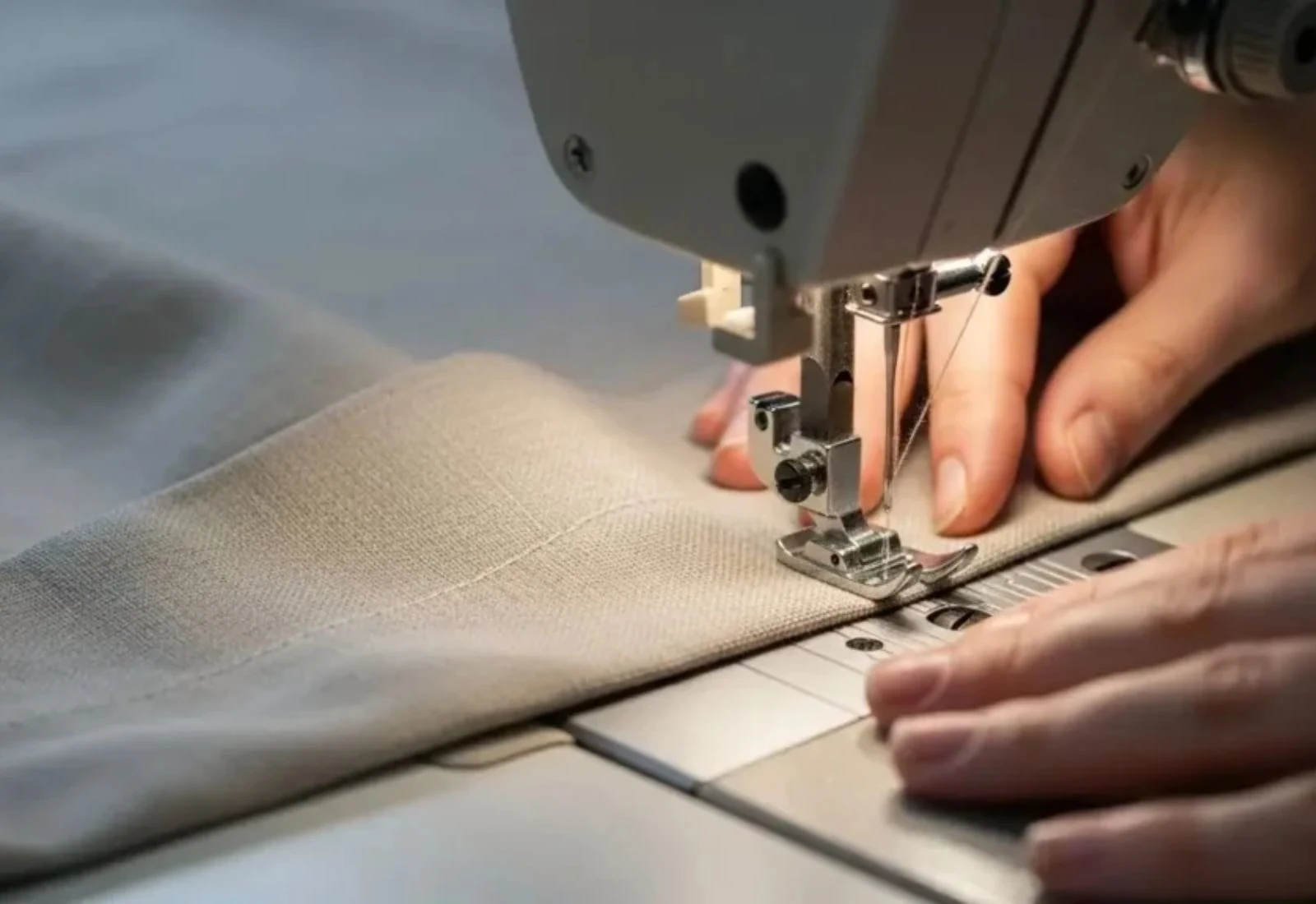 Curtain width alteration service being performed professionally