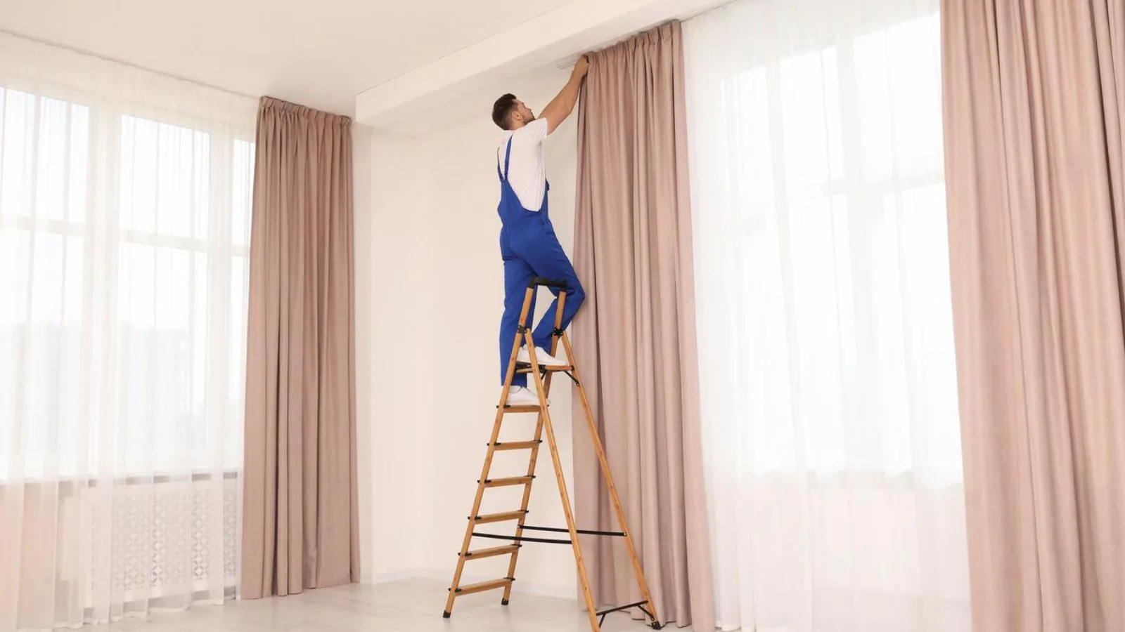 Professional curtain installation team working in Dubai