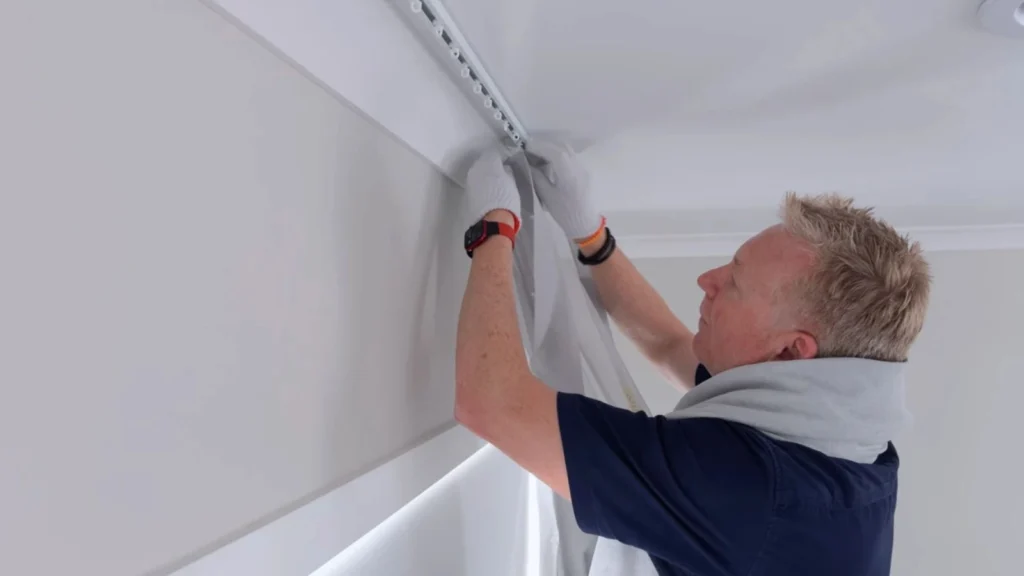 Ceiling-mounted curtain track installed in modern room