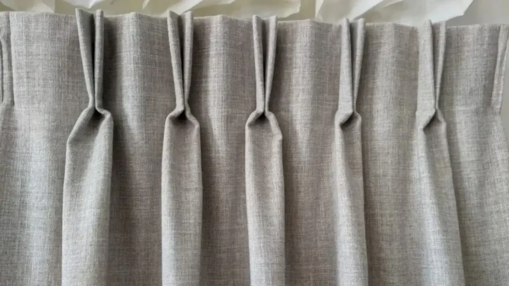 Pinch pleat curtain header with classic tailored folds