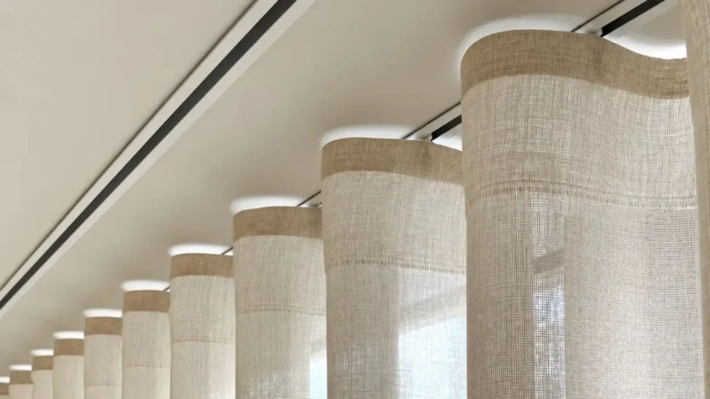 Wave fold curtain header with smooth flowing waves