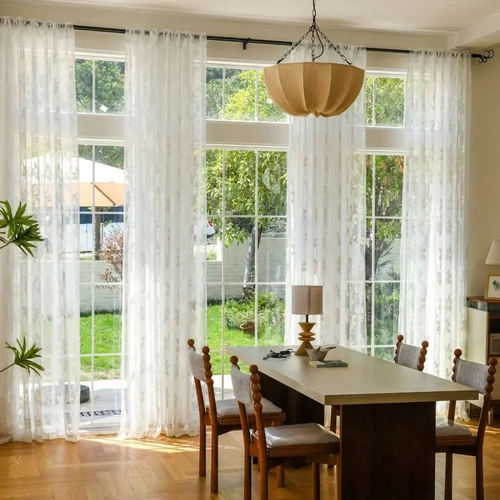 Sheer curtain installed in bright living room