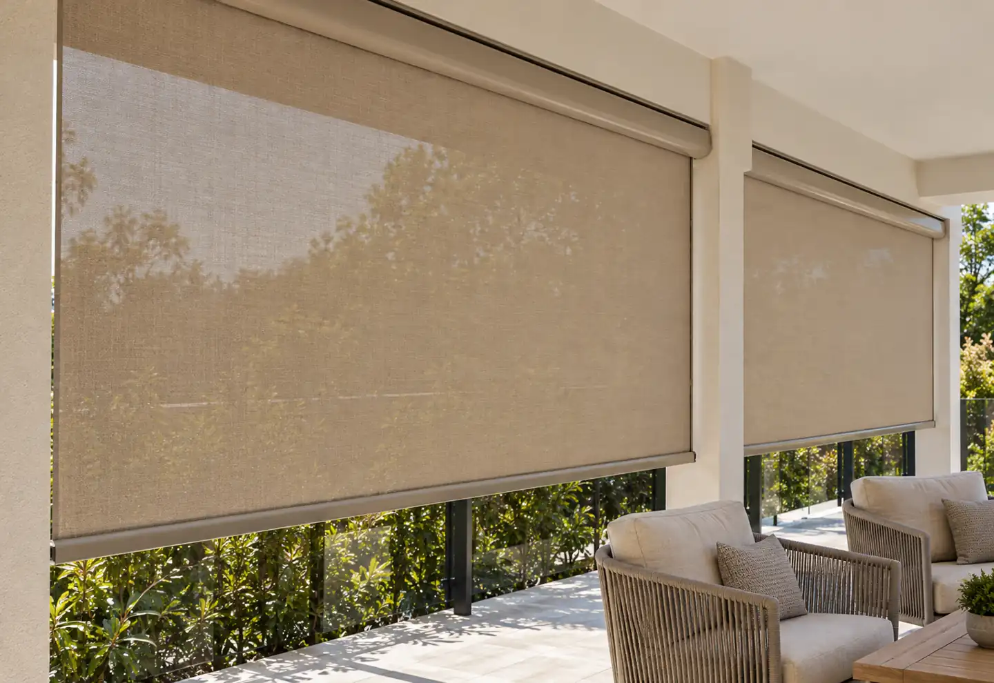 Beige roller screen on a covered balcony